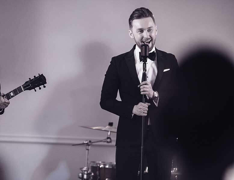 Male Wedding Singer In Tuxedo Performing At A Wedding In New Jersey