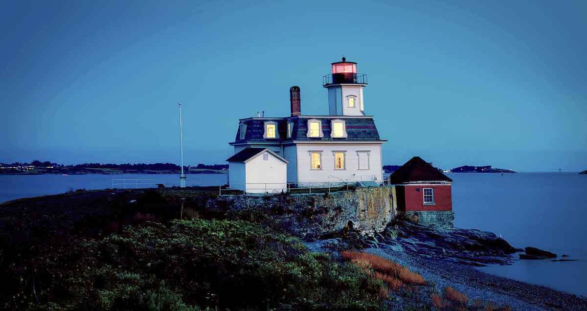 Beautiful lighthouse on shore at dusk. Know More about the Art Scene in Rhode Island