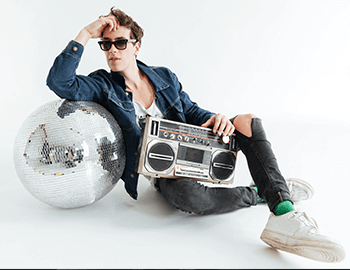 young man with disco ball and boombox